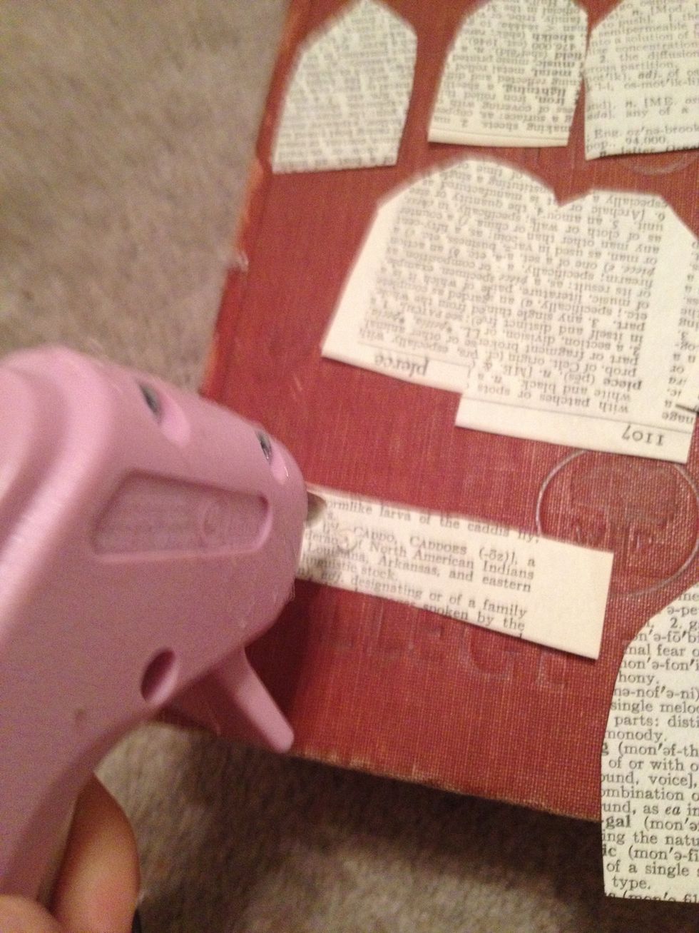 Place some hot glue on a long rectangle piece of paper