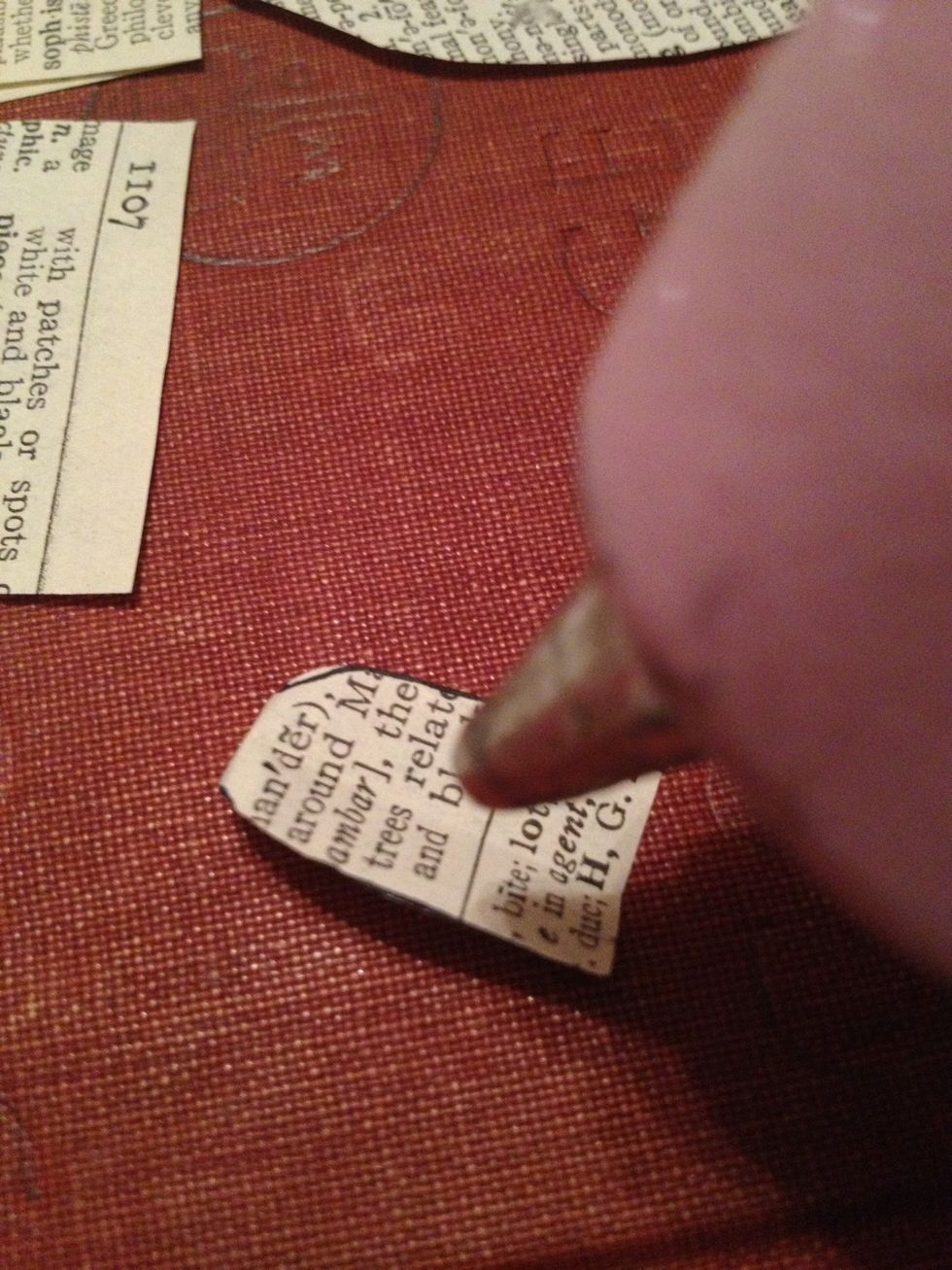 Place some hot glue on the crease down the middle