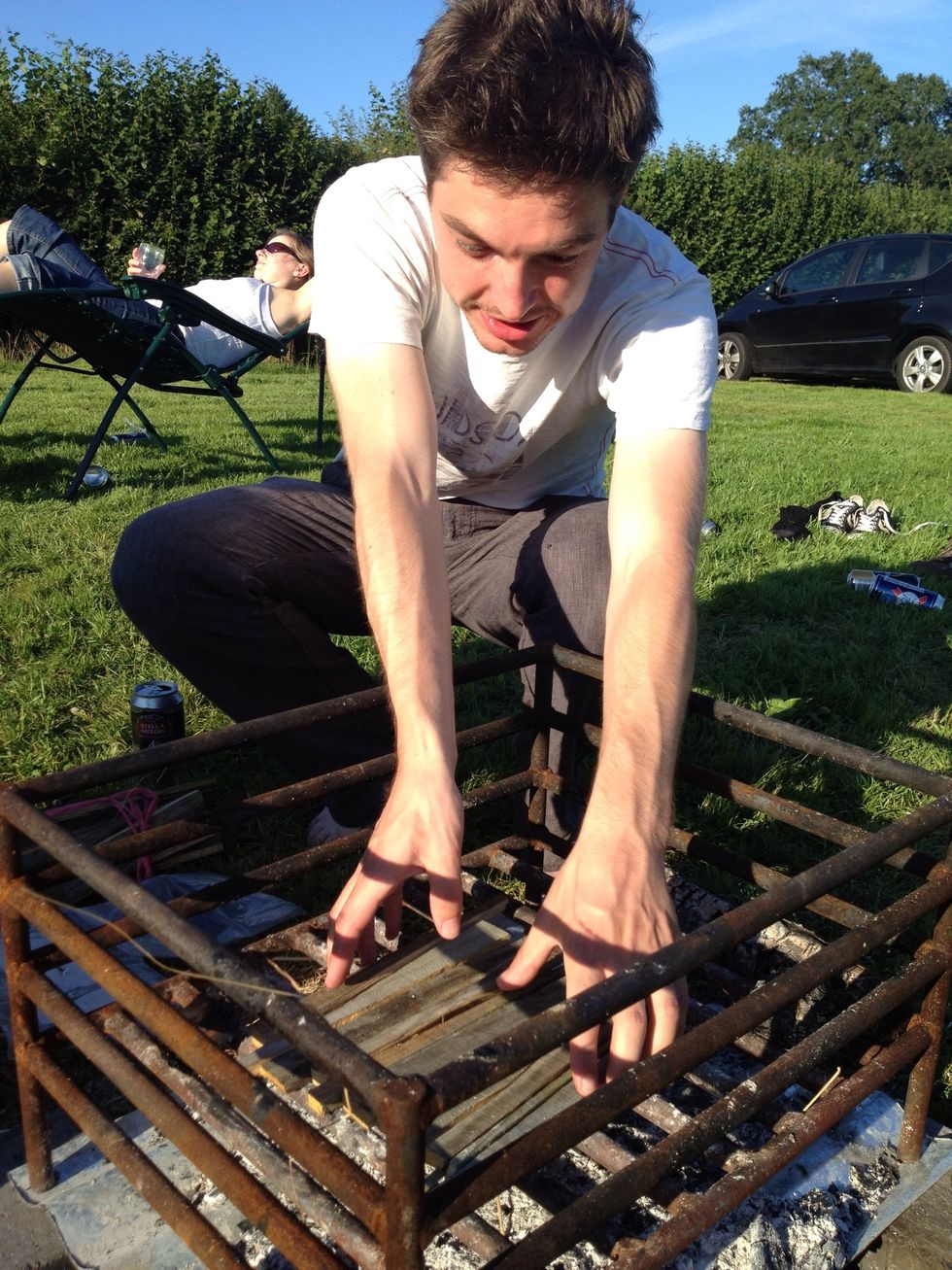 Place some kindling in the basket to make a base so stuff doesnt fall through. (Spectators should ensure of a full glass of wine at this point)