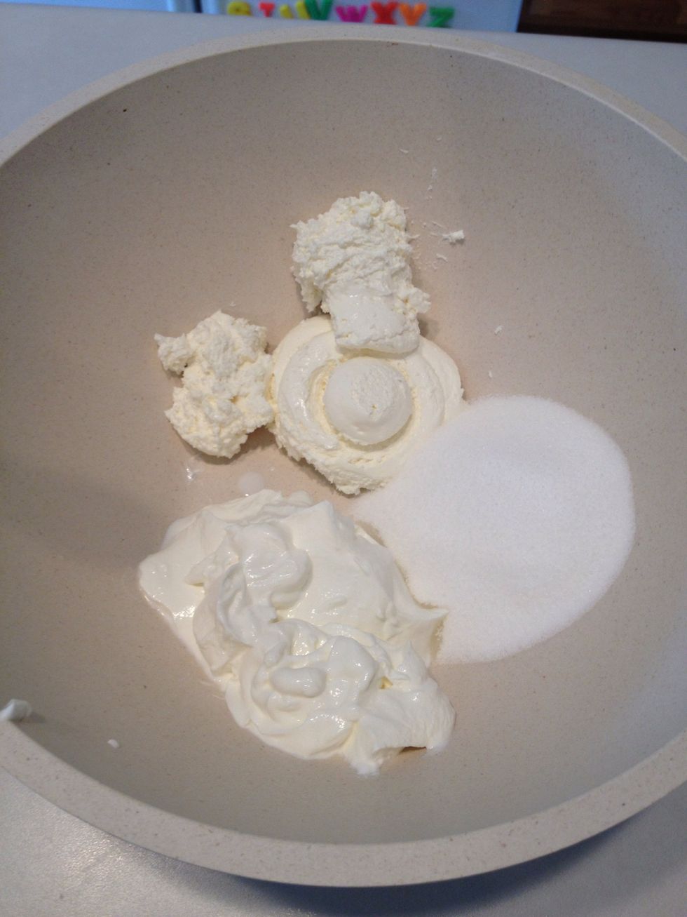 Place sour cream, cream cheese and white sugar in a bowl.  Stir well.