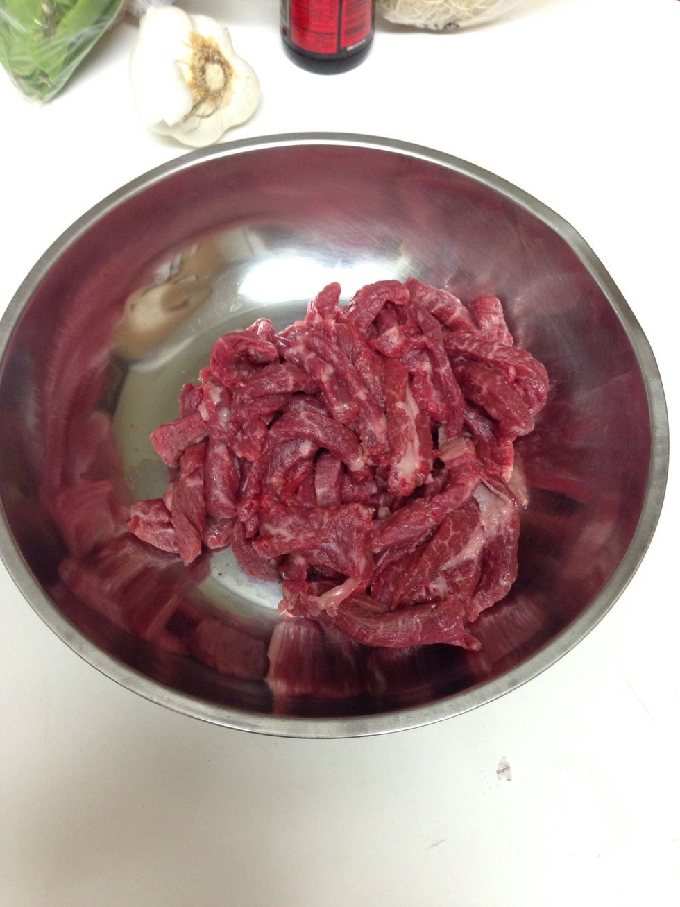 Place steak in bowl