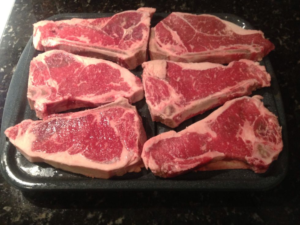 Place steaks onto broiler pan.