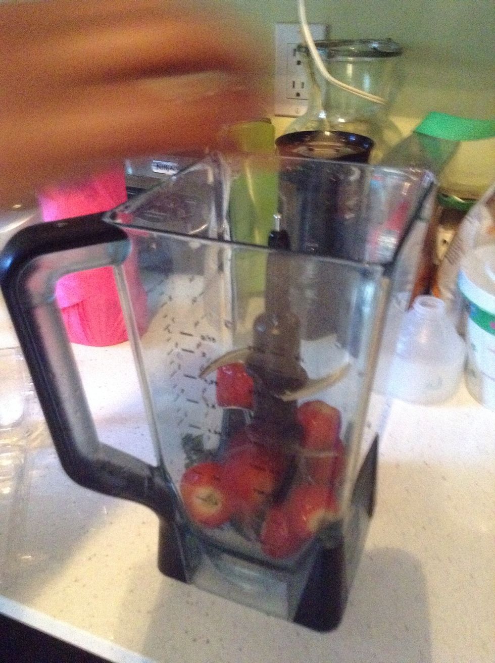 Place strawberries in blender.