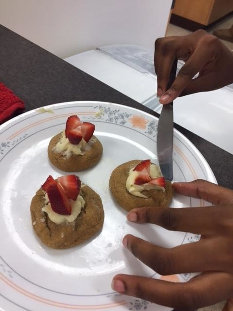 Place strawberries on top of cream cheese