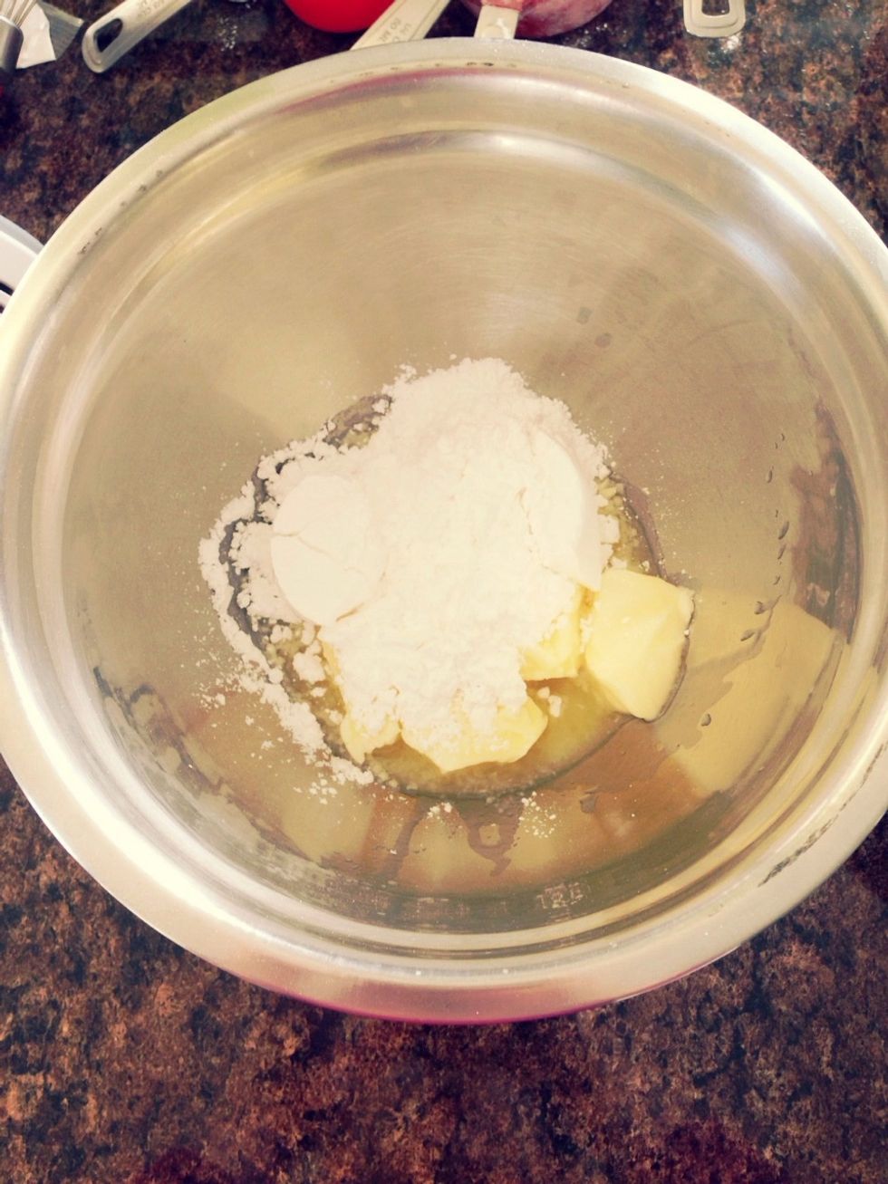 Place sugar and butter in a medium bowl.