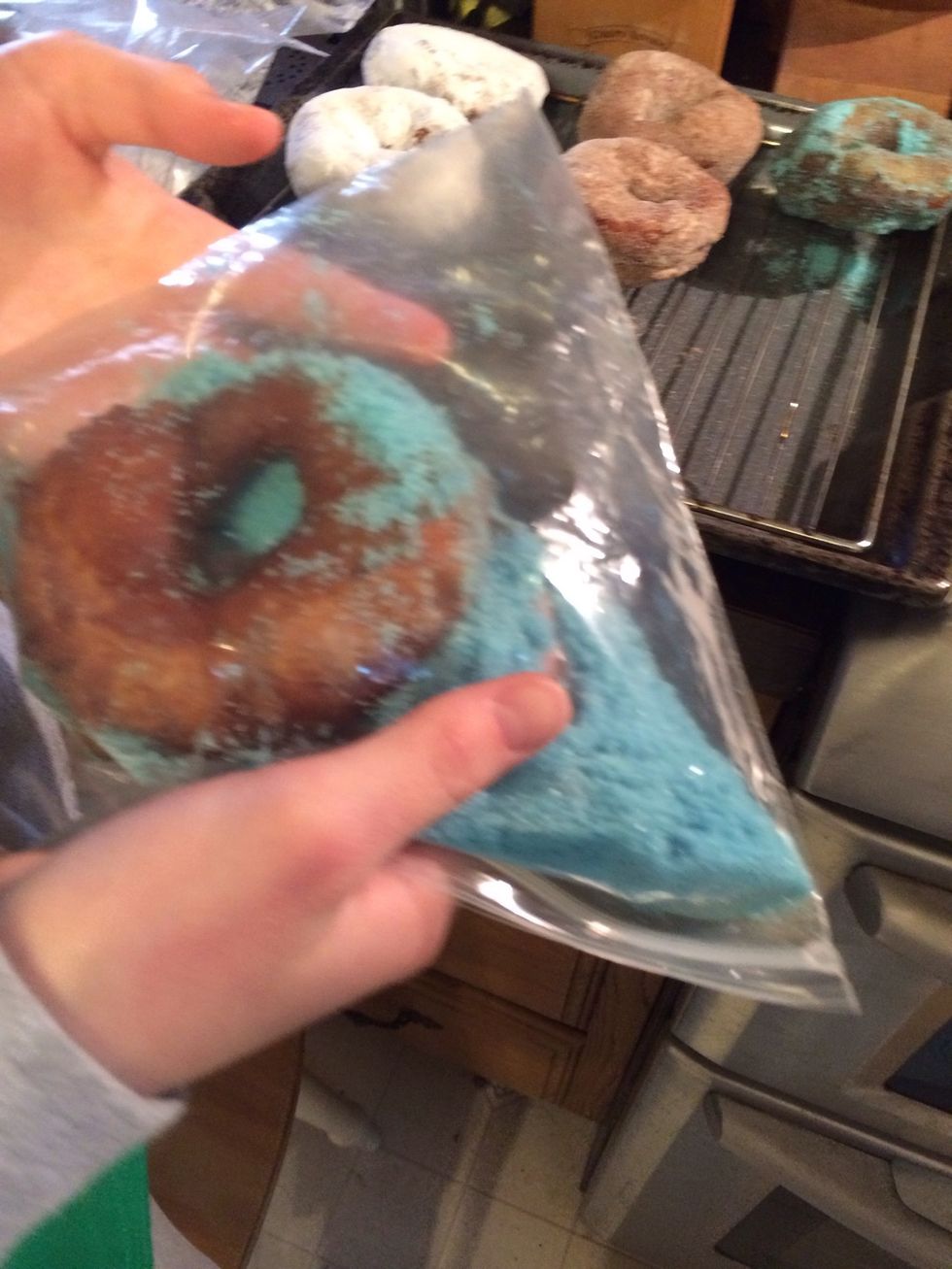 Place sugar in baggie with blue food coloring for smurfy sugar doughnuts.