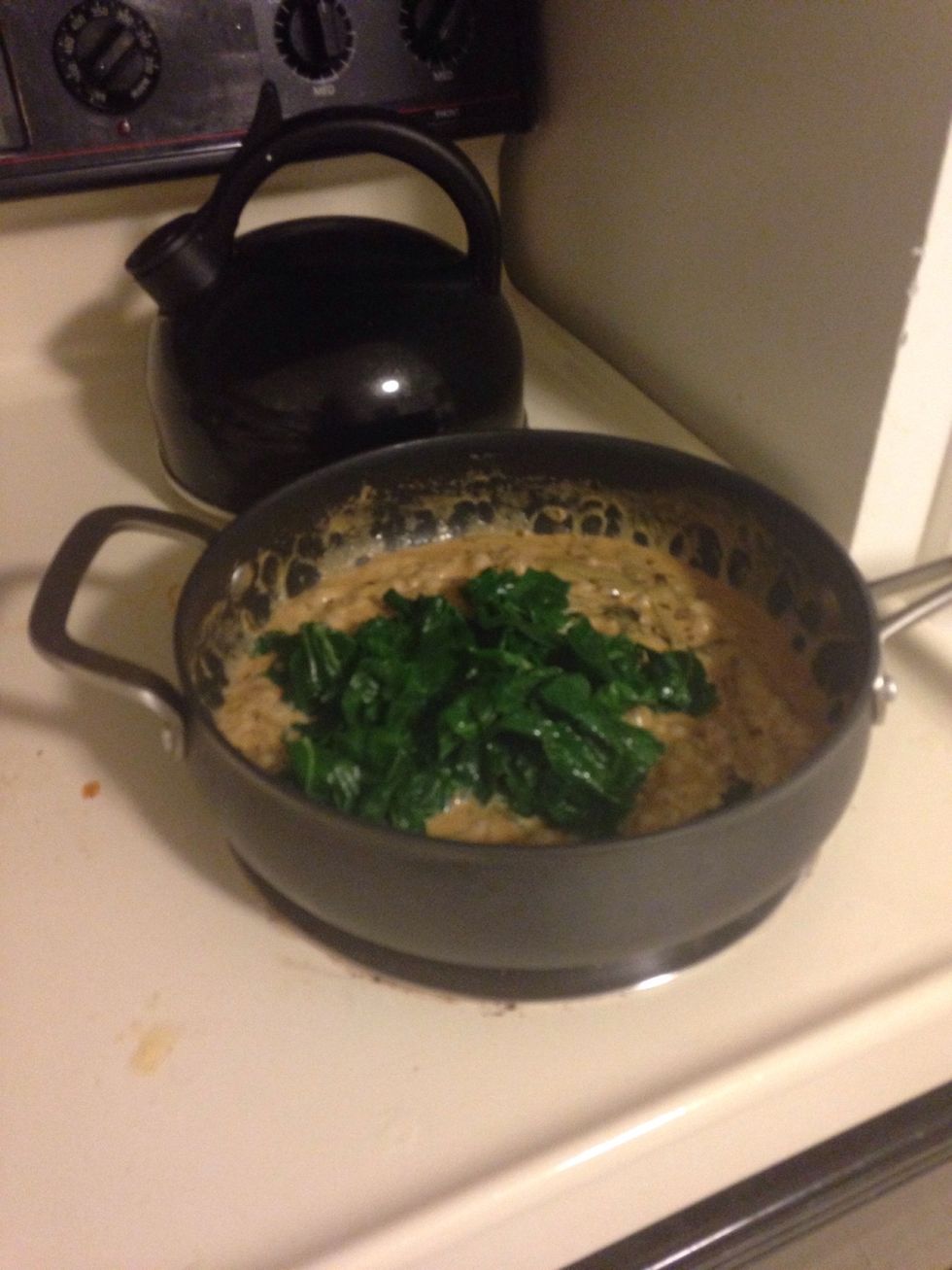 Place Swiss chard into saucepan. Cook until Swiss chard is heated through and covered in cream.