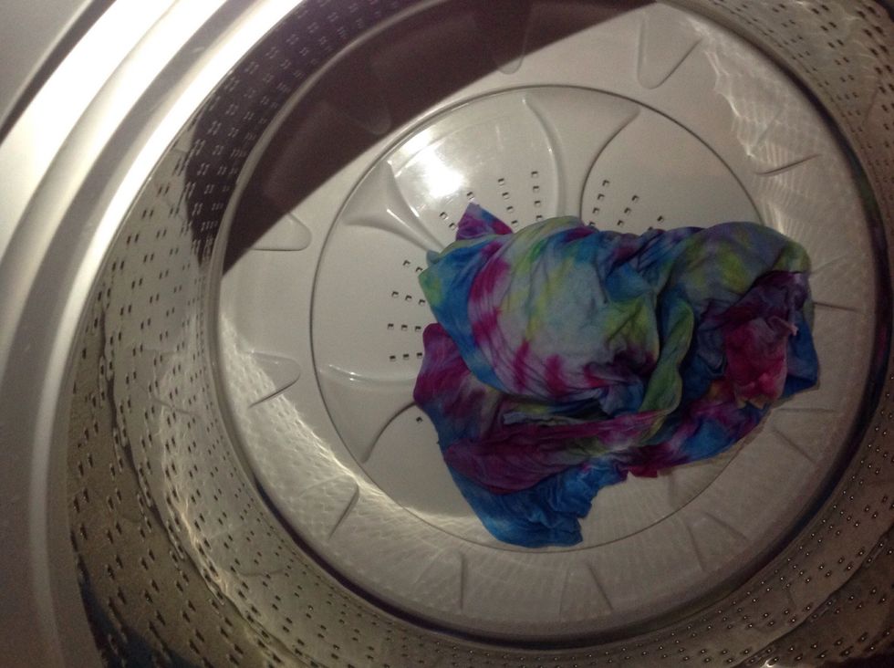 Place t-shirt separately into washing machine and put on cold with whatever detergent you normally use for colored cotton.