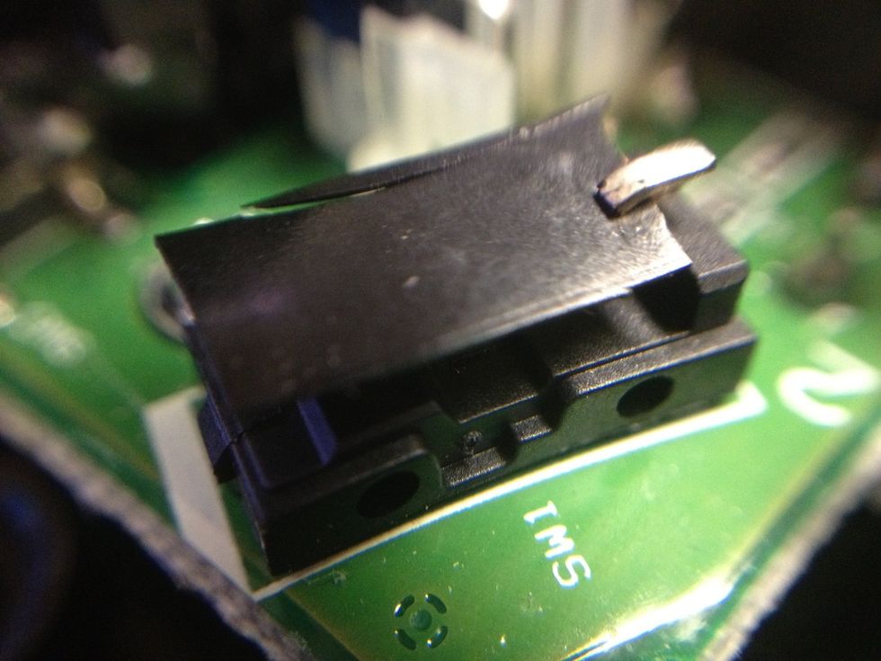 Place tap over the top of the conductive metal. Make sue the tape is under the back tab.