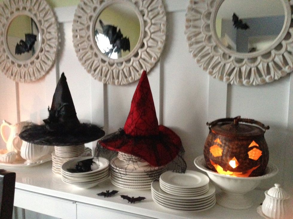 Place the 2 witch hats together wherever your guest will see them as they enter the room. Same for the large metal pumpkin lantern.