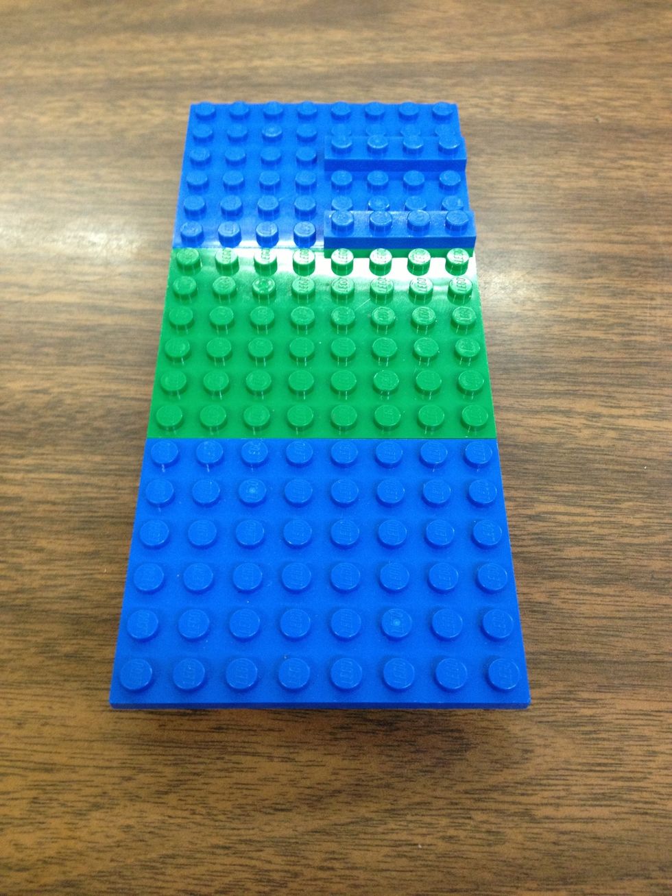 Place the 3 large thin plates on the beams and the two small thin plates in the back.