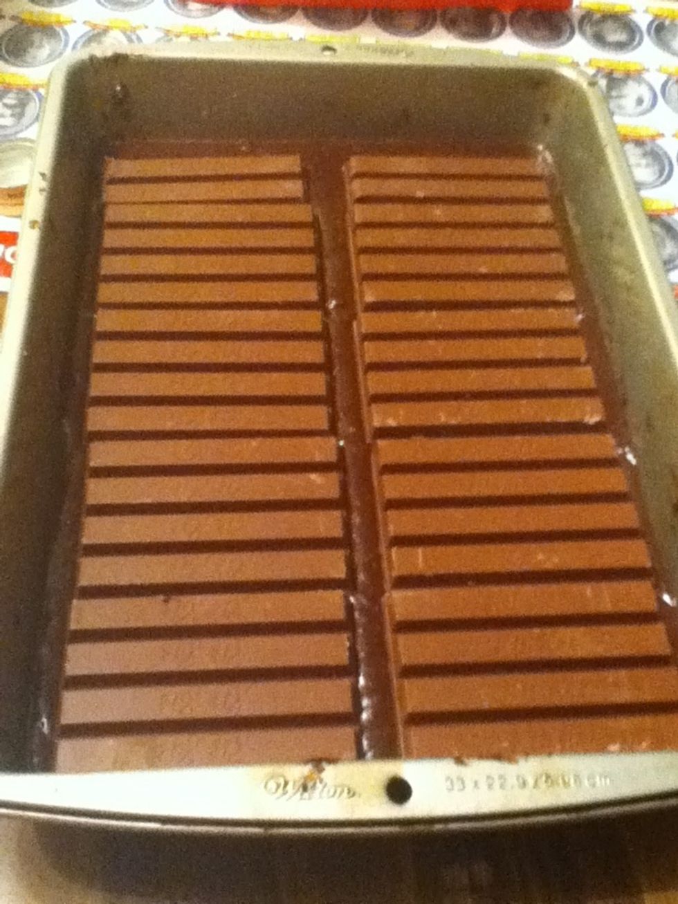 Place the 3 XL Kit Kat bars over the layer of brownie mix.