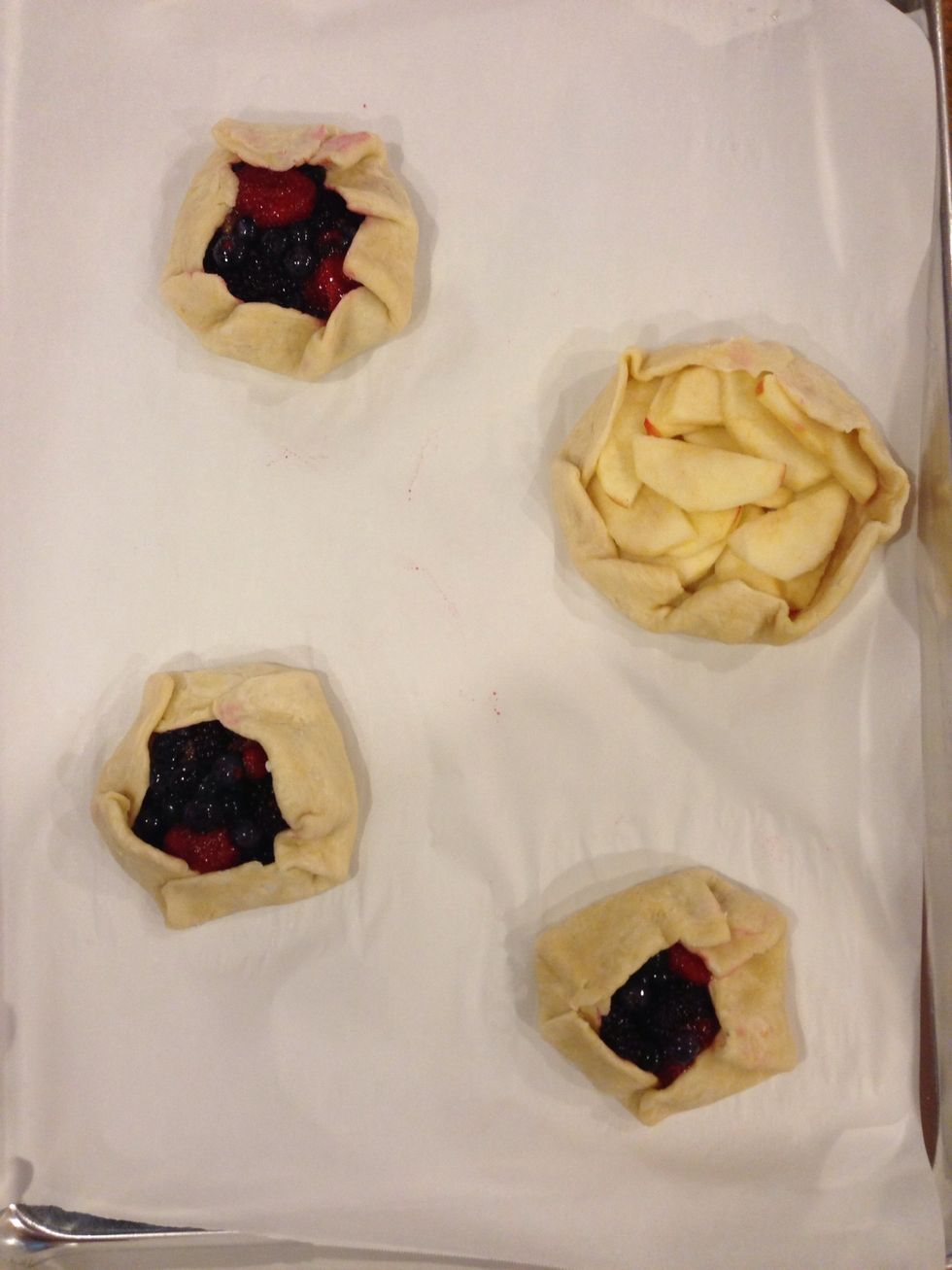 Place the apple in one, and fold together the sides. (This was my first time folding, and it turned out pretty well! Just do your best, it'll still taste good!) :)