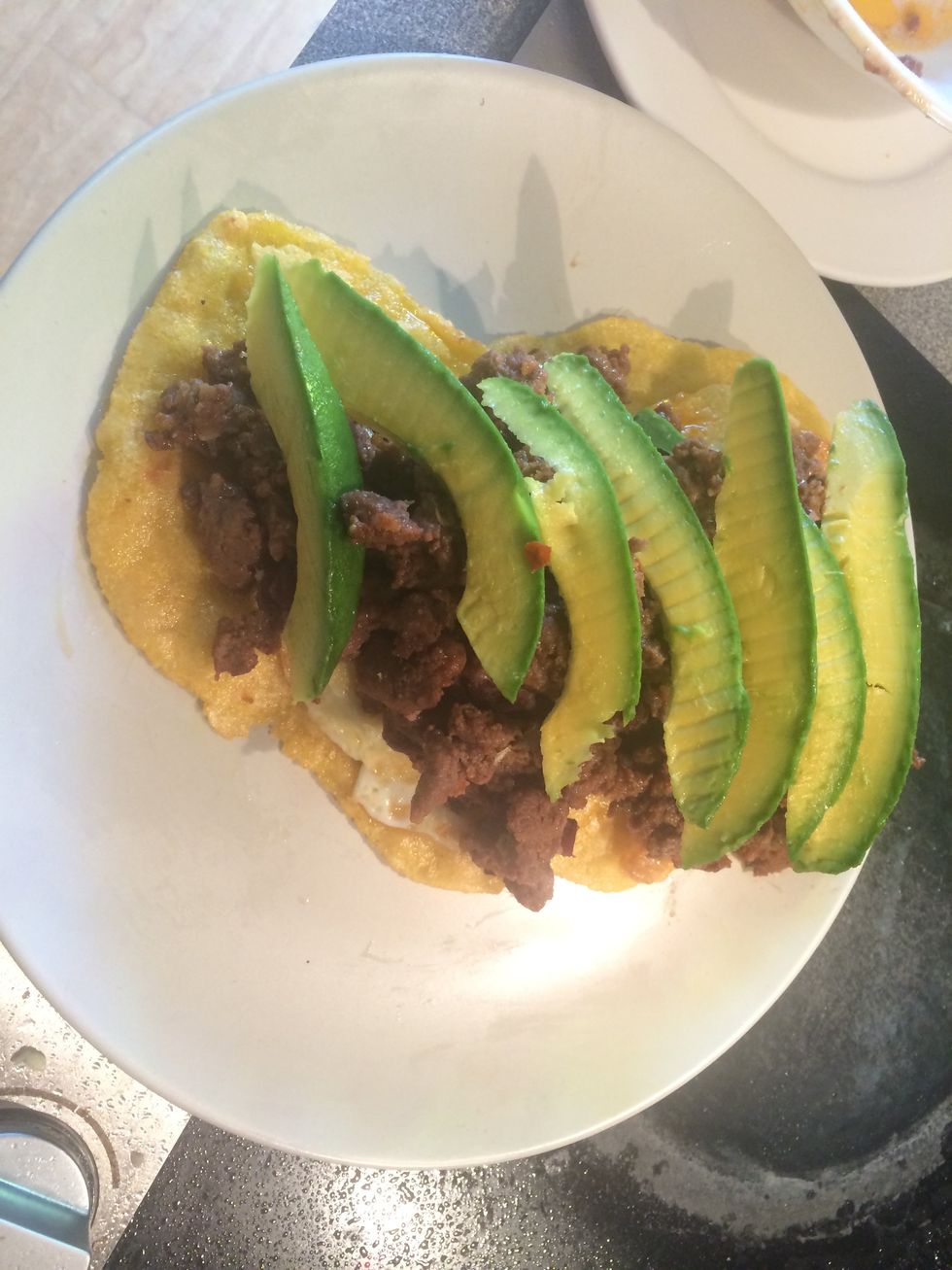 Place the avocado onto of the chorizo.