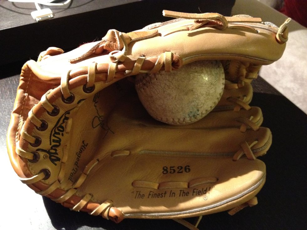 Place the ball in inner heel of the glove.