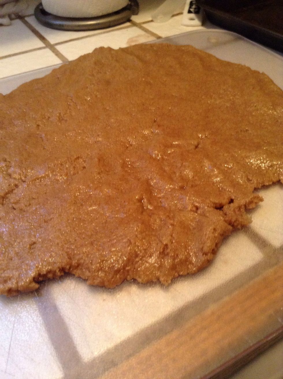 Place the ball on wax paper and then another on top. Roll the dough flat into a very thin width. The thickness is your own personal preference