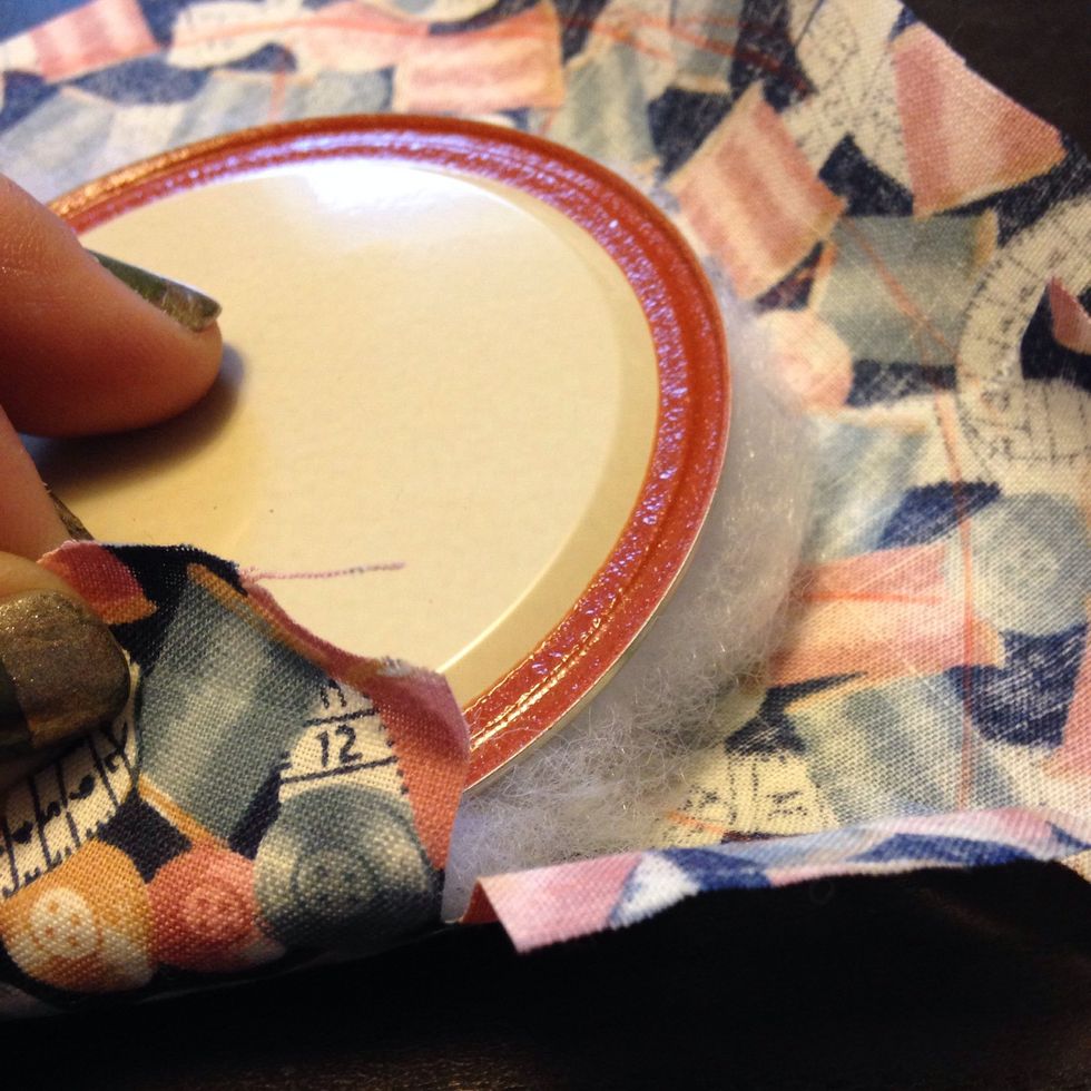 Place the balled up stiffing under the lid. Glue one piece of the fabric at a time to the lid