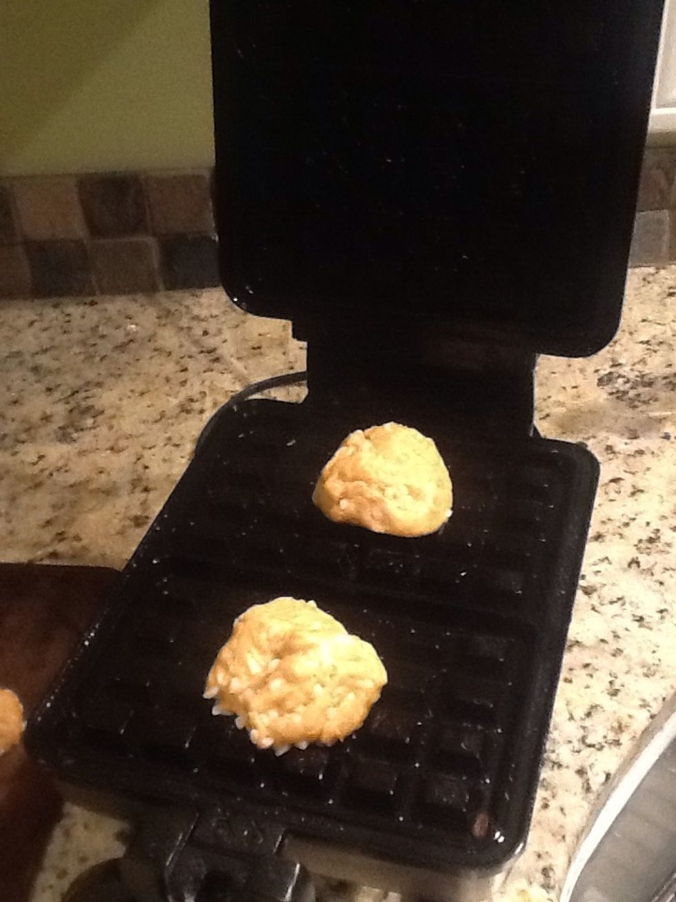 Place the balls on the waffle maker and cook on medium high for approx. 1 or 2 minutes