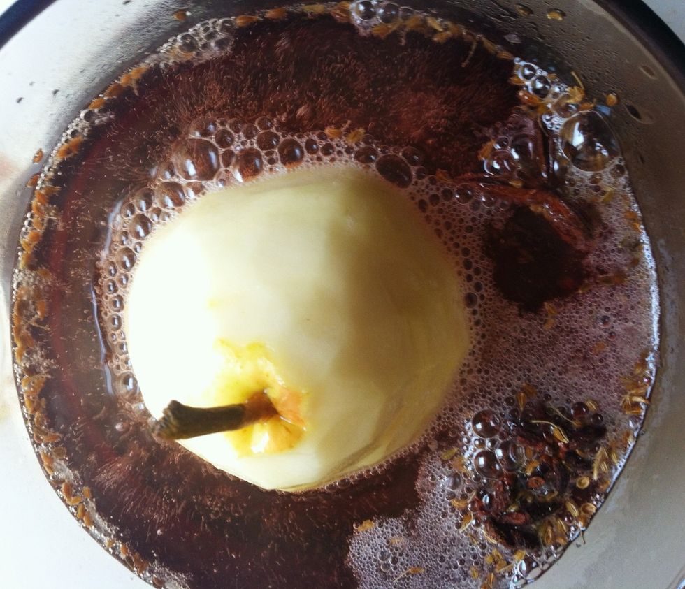 Place the base of the pear in the saucepan. Pour water to about 1 inch from the top of the pear. Cook for 1 hour. Don't overcook or pear will fall apart.