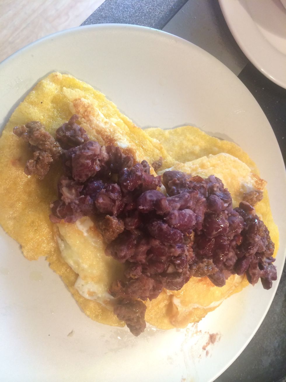 Place the beans on top of the eggs.