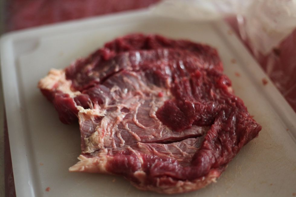 Place the beef on a cutting board and serrate the beef as much as possible without going through to the bottom. You may use a meat hammer to tenderize the beef. I prefer the anti violent method. Lol.