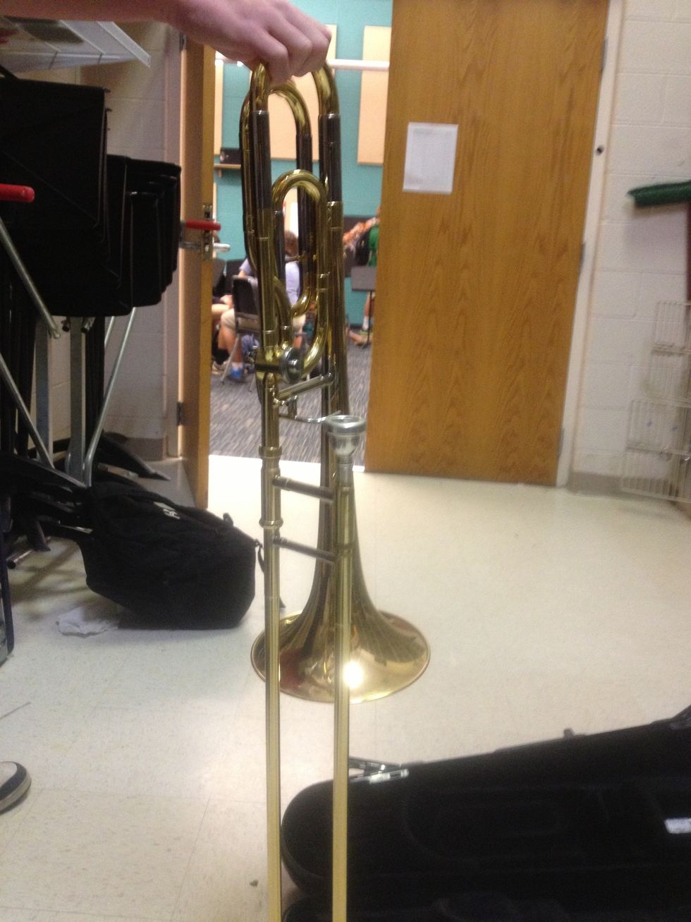 Place the bell on the other side of the slide so it is away from you.