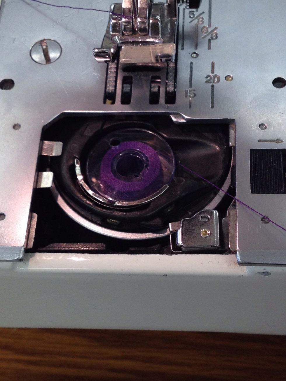 Place the bobbin in the bobbin holder.