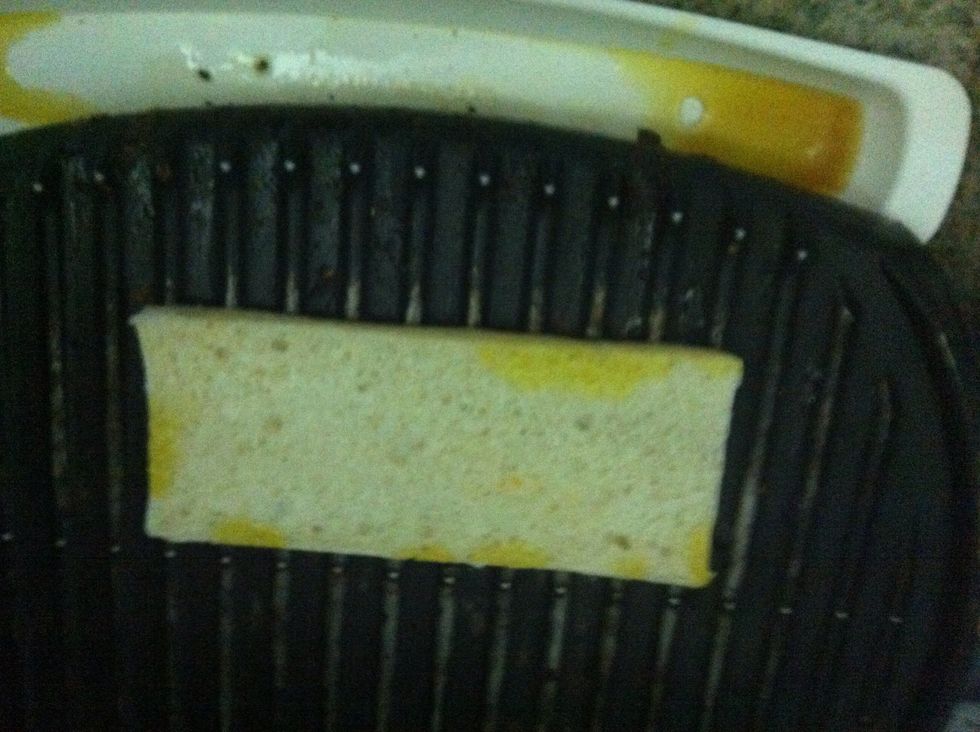 Place the bottom piece oil side down on a panini press or a george forman grill