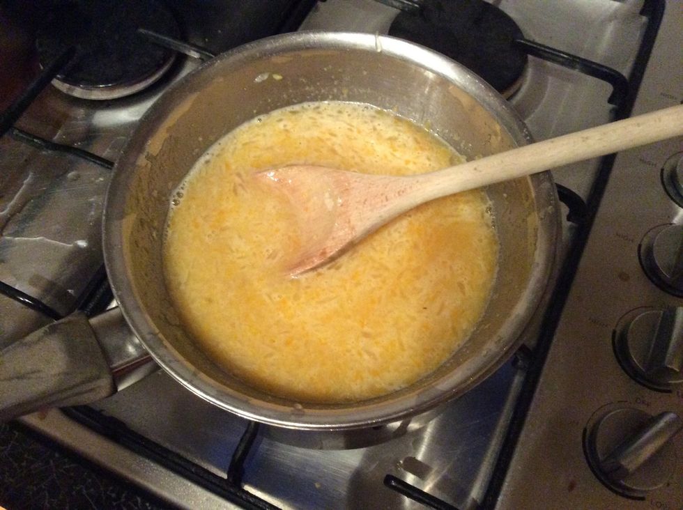 Place the bowl over a saucepan of simmering water. Stir with a wooden spoon and cook for about 20 minutes or until custard-like