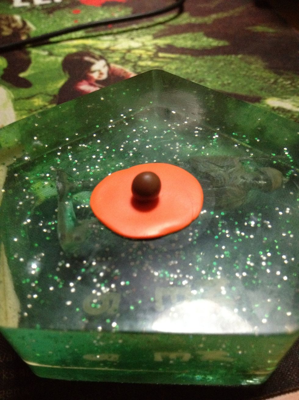 Place the brown clay on top of the flatten casing.