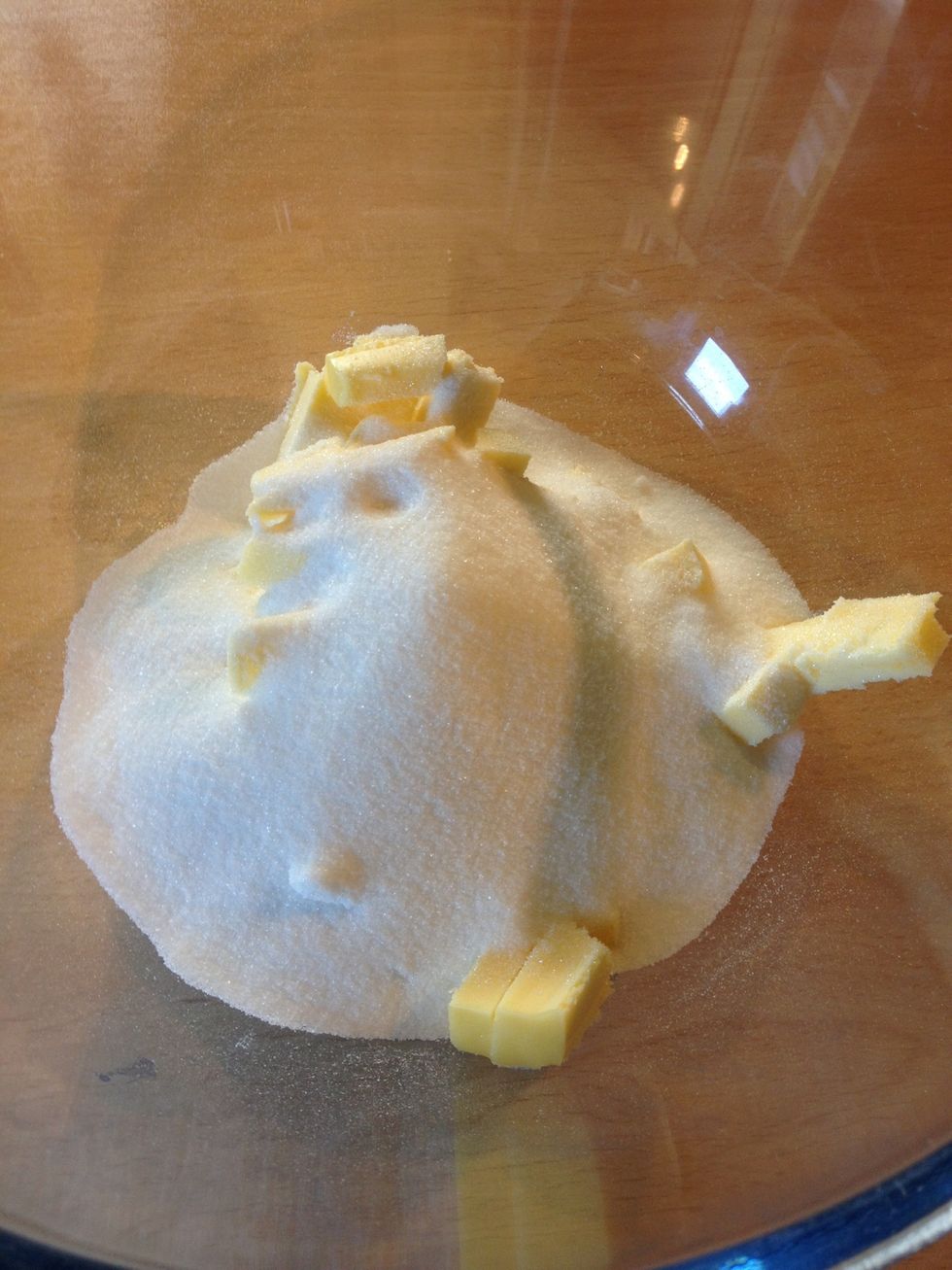 Place the butter and sugar in a large bowl.