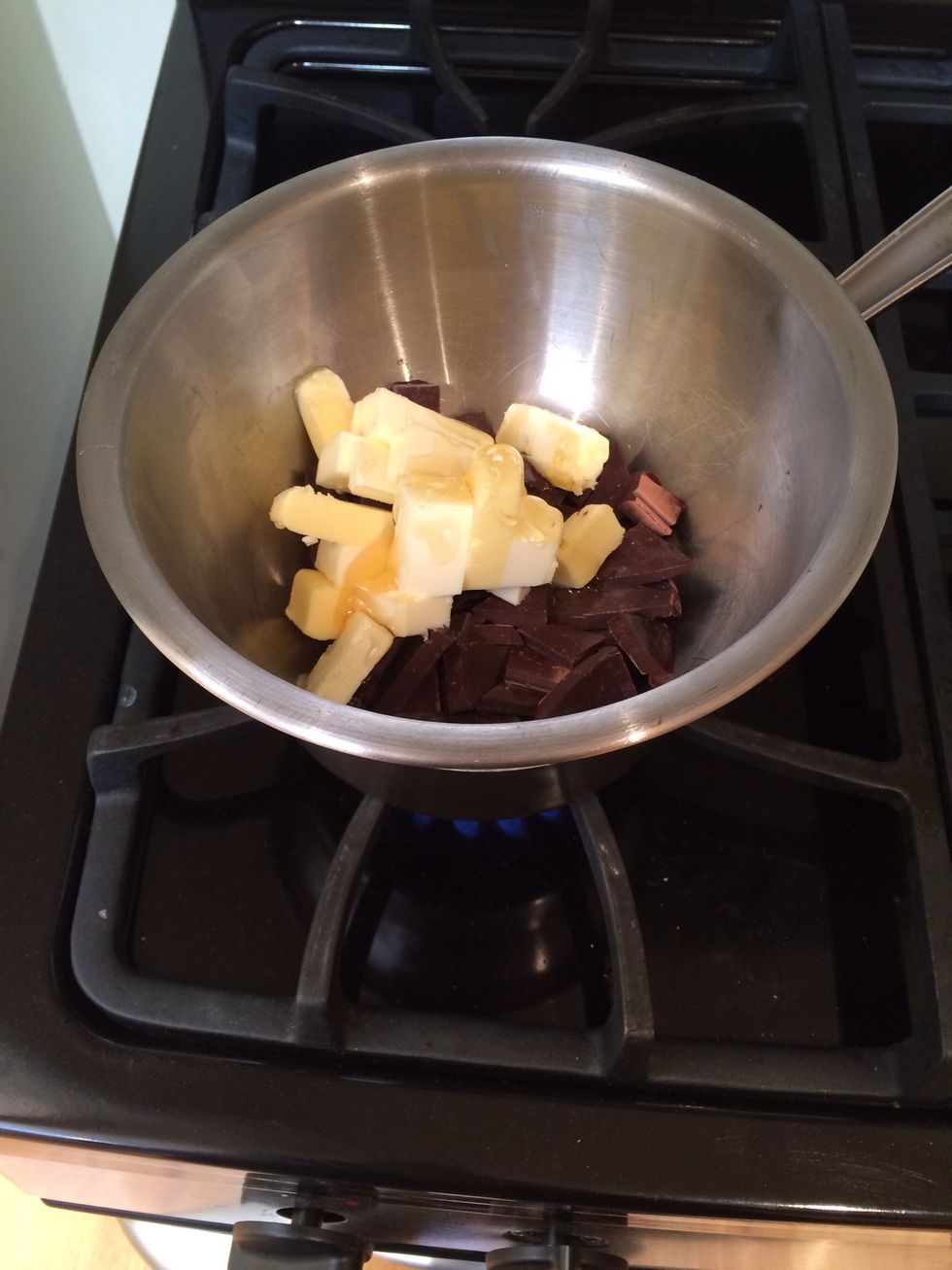 Place the butter, chocolate and honey in a double boiler (so there is a saucepan of simmering water underneath the bowl containing the ingredients). Stir until all ingredients have melted.
