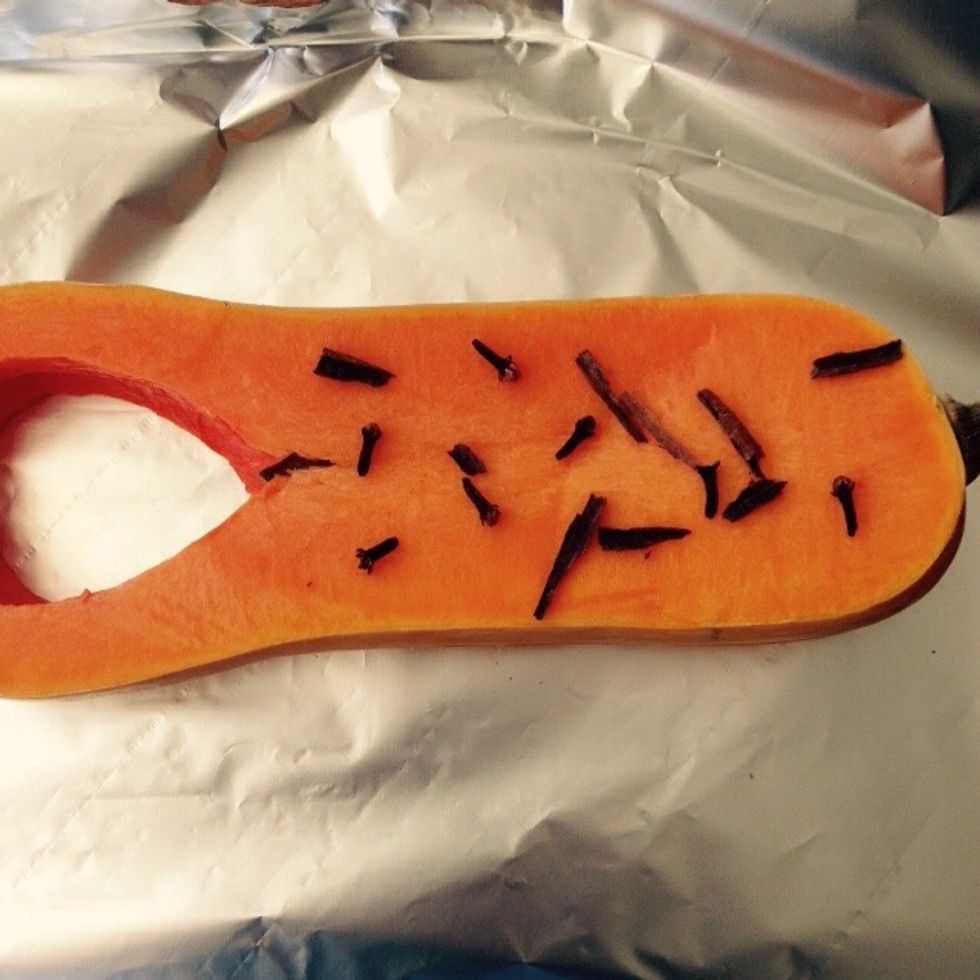 Place the butternut squash slices on top and then additional spices over.