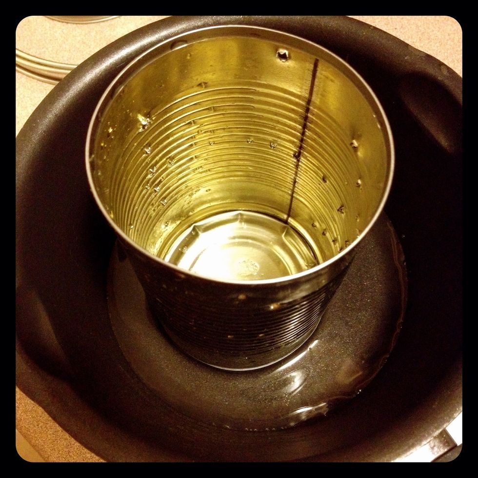 Place the can in a bowl to let the ice melt.