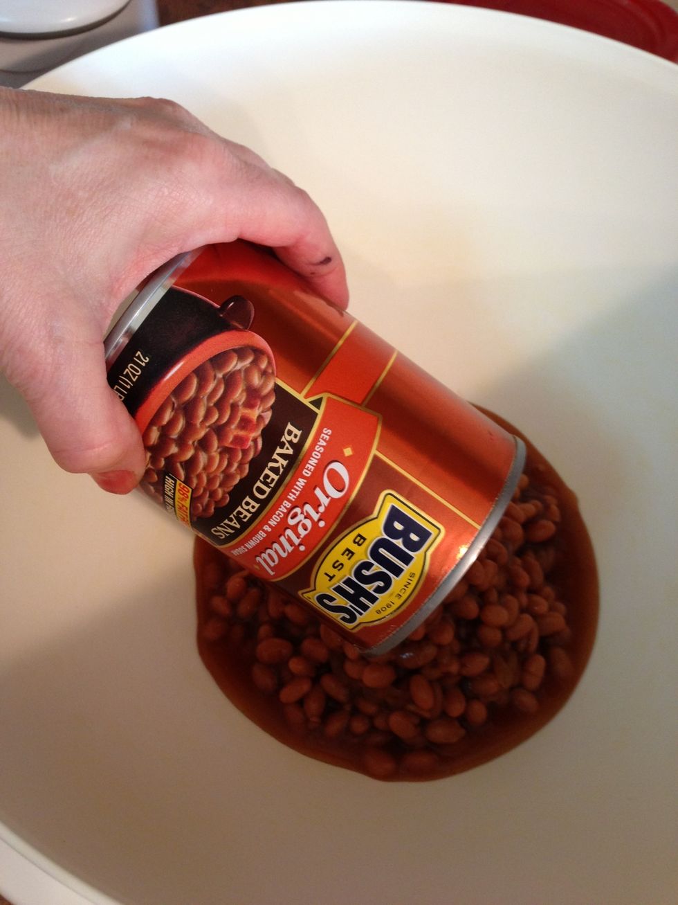 Place the can of Baked Beans WITH its liquid into large mixing bowl while other beans drain.