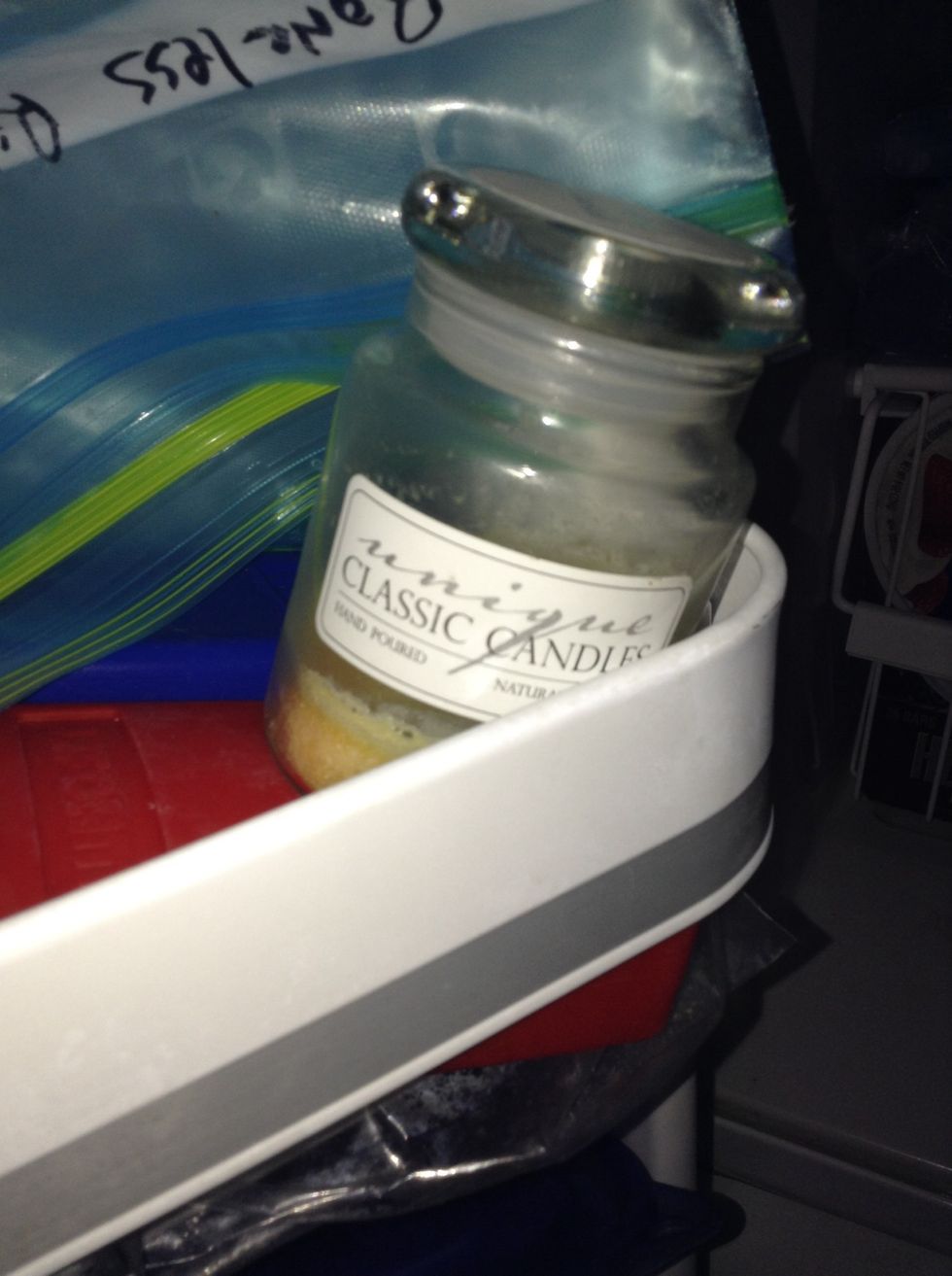 Place the candle in the freezer for about an hour