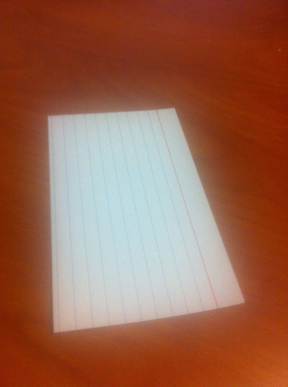 Place the card vertically on a hard and flat surface. This will make folding the card easier.