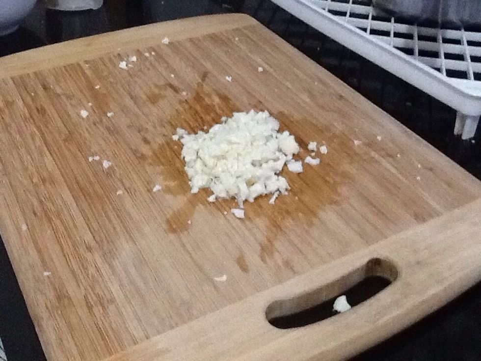 Place the cauliflower into a small bowl.