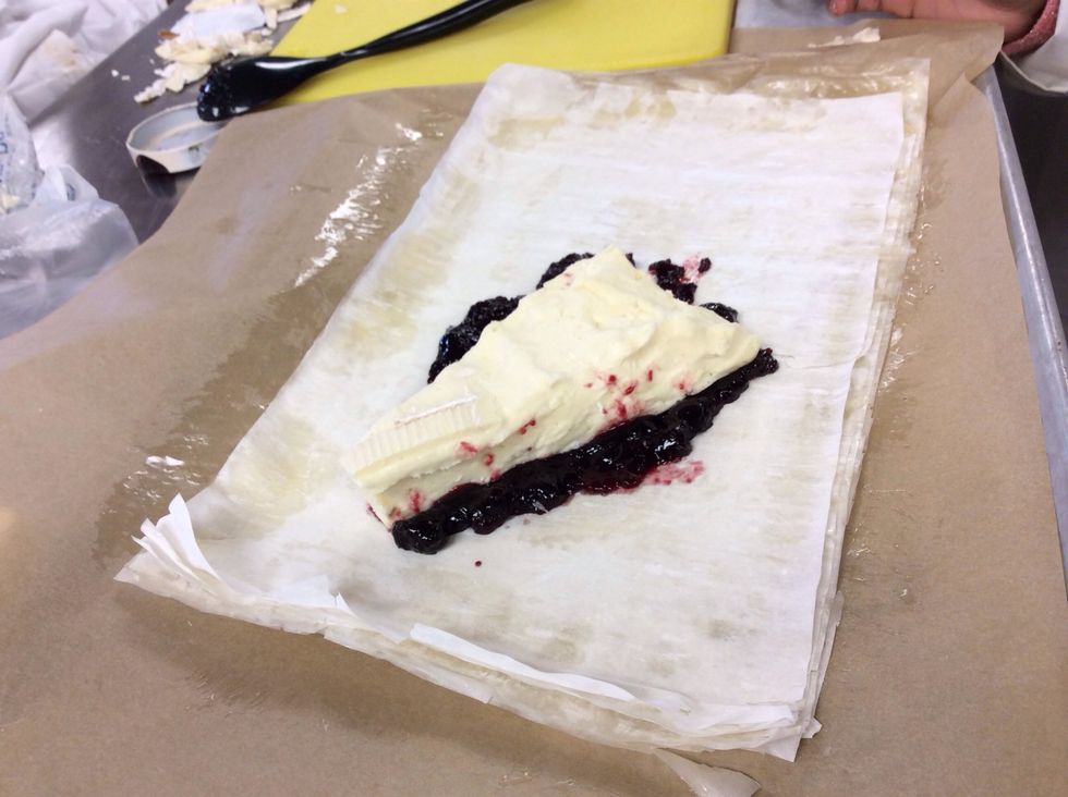 Place the cheese on top of the cherry preserves