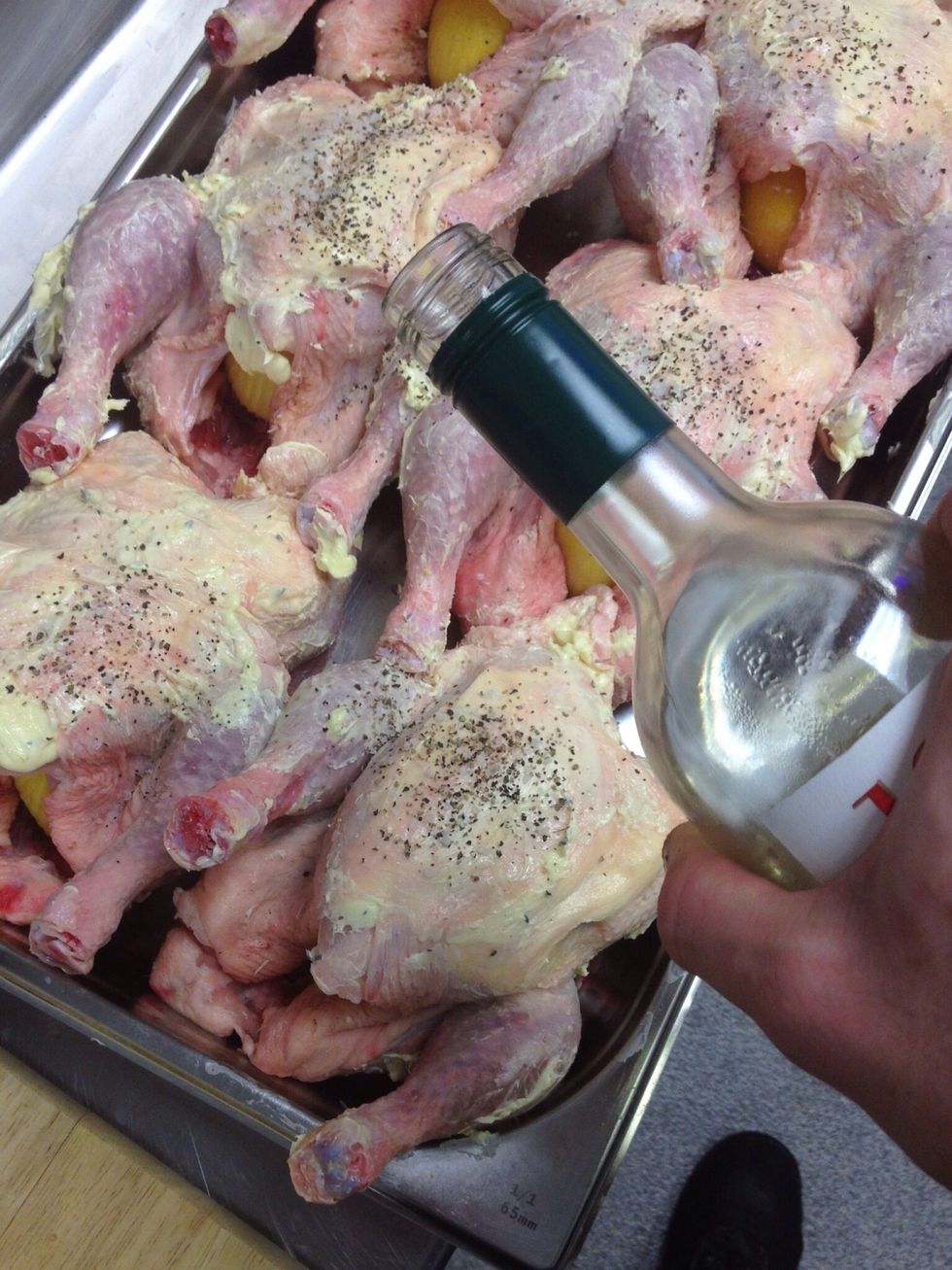 Place the chicken in the tray with the water & the wine and preheat the oven to 175c/gas mark 4.5