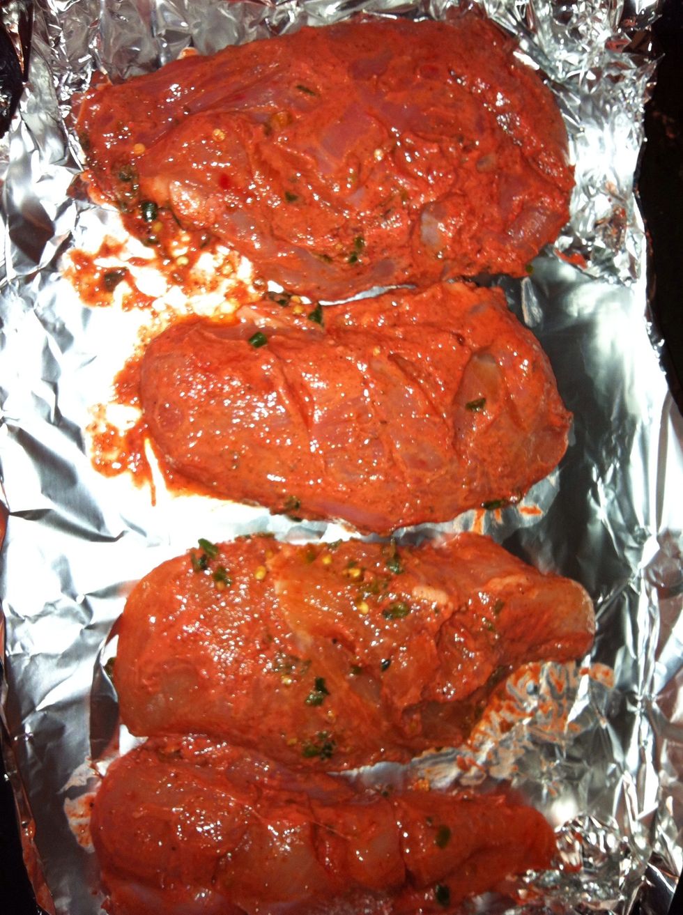 Place the Chicken on a Baking Tray I always use foil lining on my tray..... Place the Chicken in the Oven for 20 mins. You can the grill.  Ensure the meat is cooked through before eating.