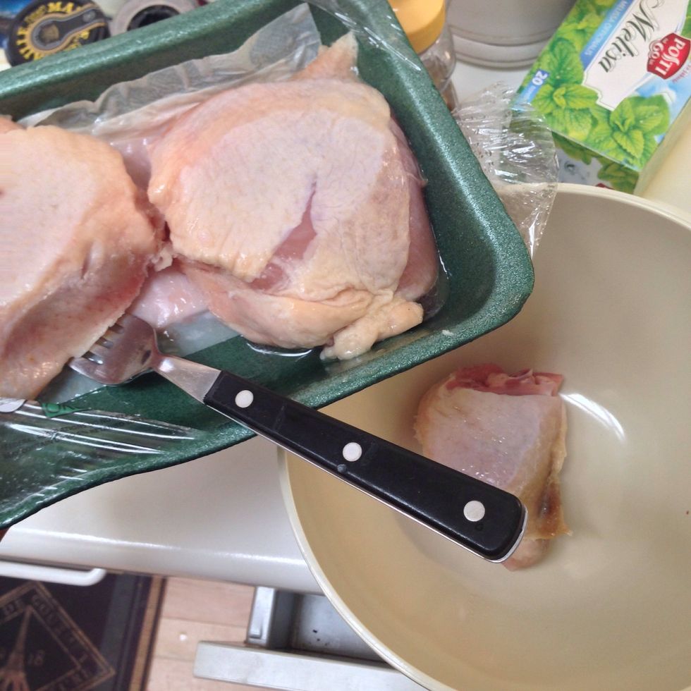 Place the chicken thighs in a size able bowl.