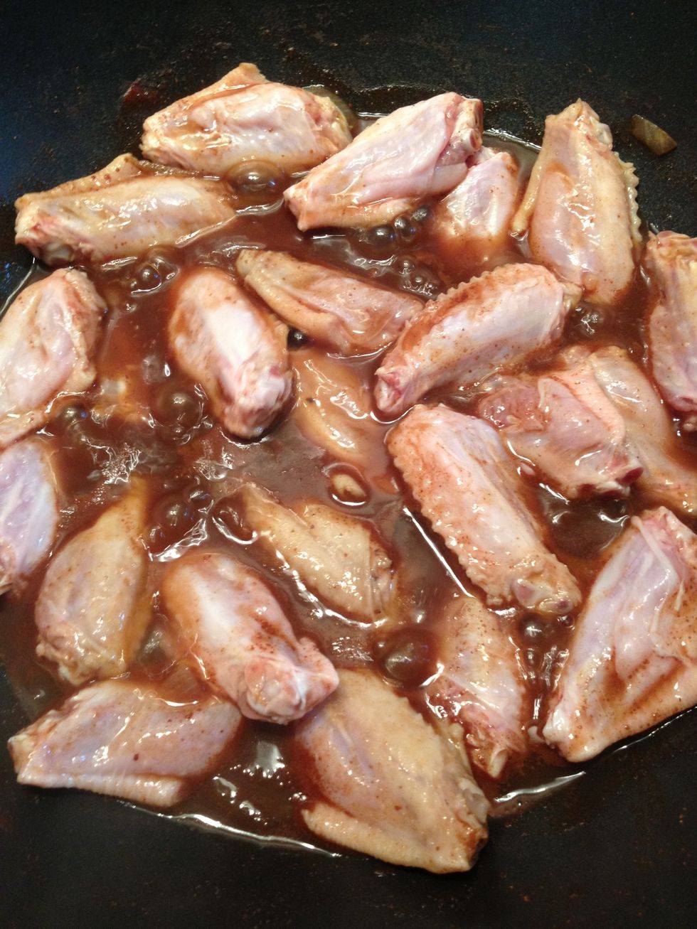 Place the chicken wings into the pan. Do not overcrowd the pan with too much chicken.