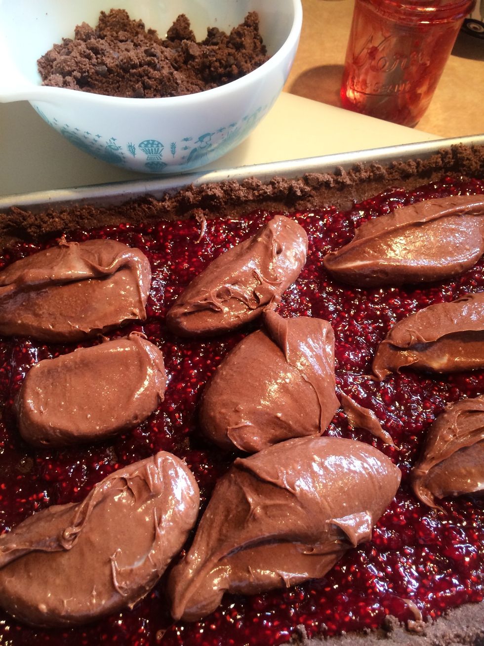 Place the chocolate cream cheese mixture on top of the raspberry and crumb crust.