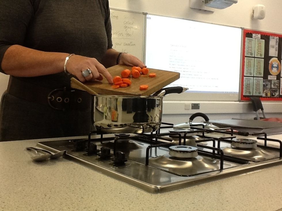 Place the chopped carrots in the saucepan.