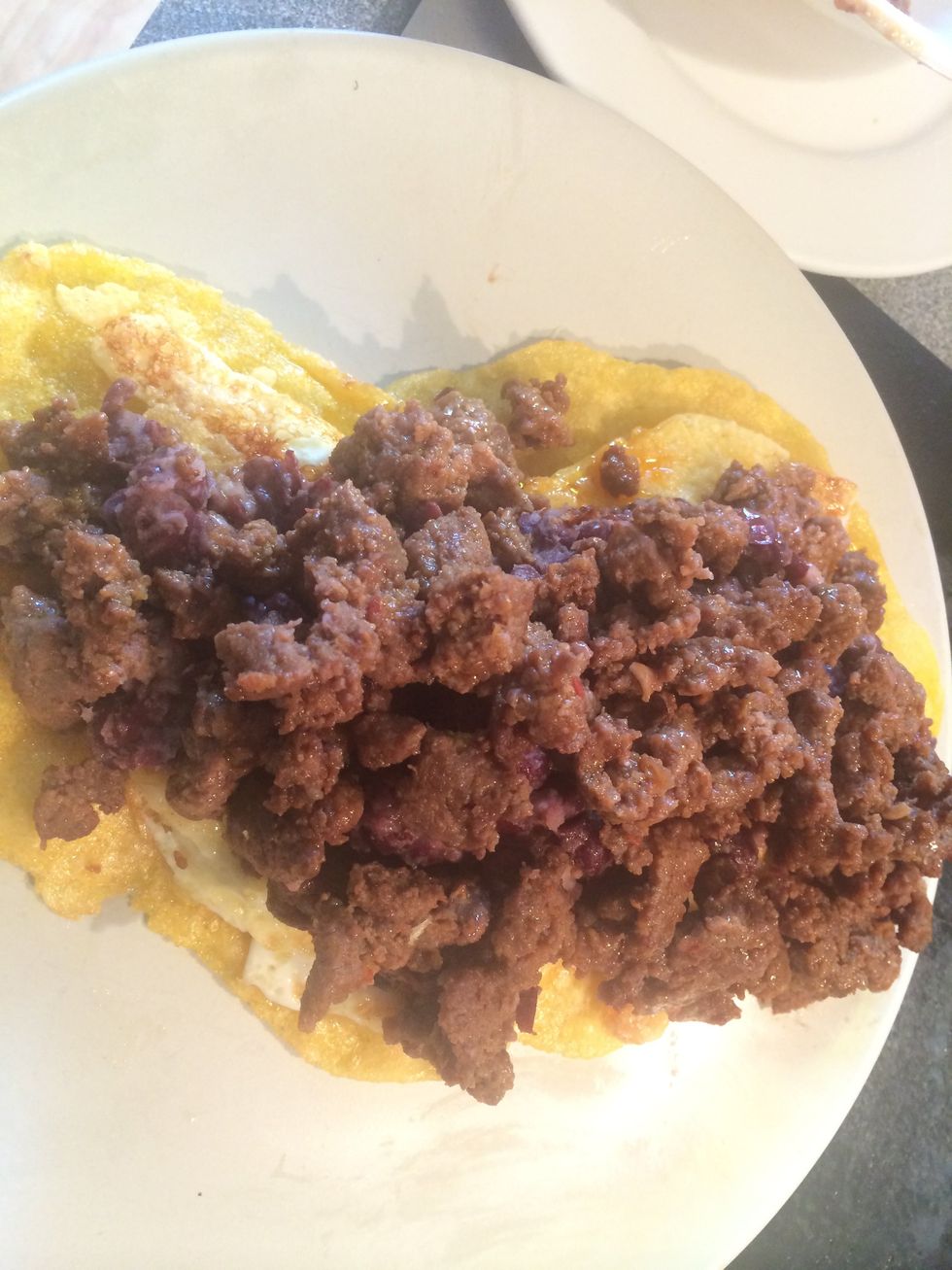 Place the chorizo on top of the beans.