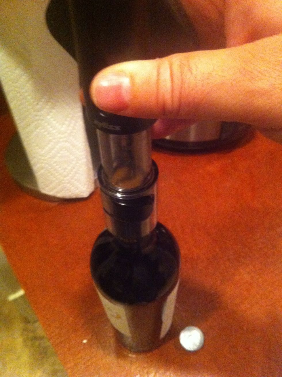 Place the corkscrew atop the exposed cork. Be civil, this is a precarious moment of trust.