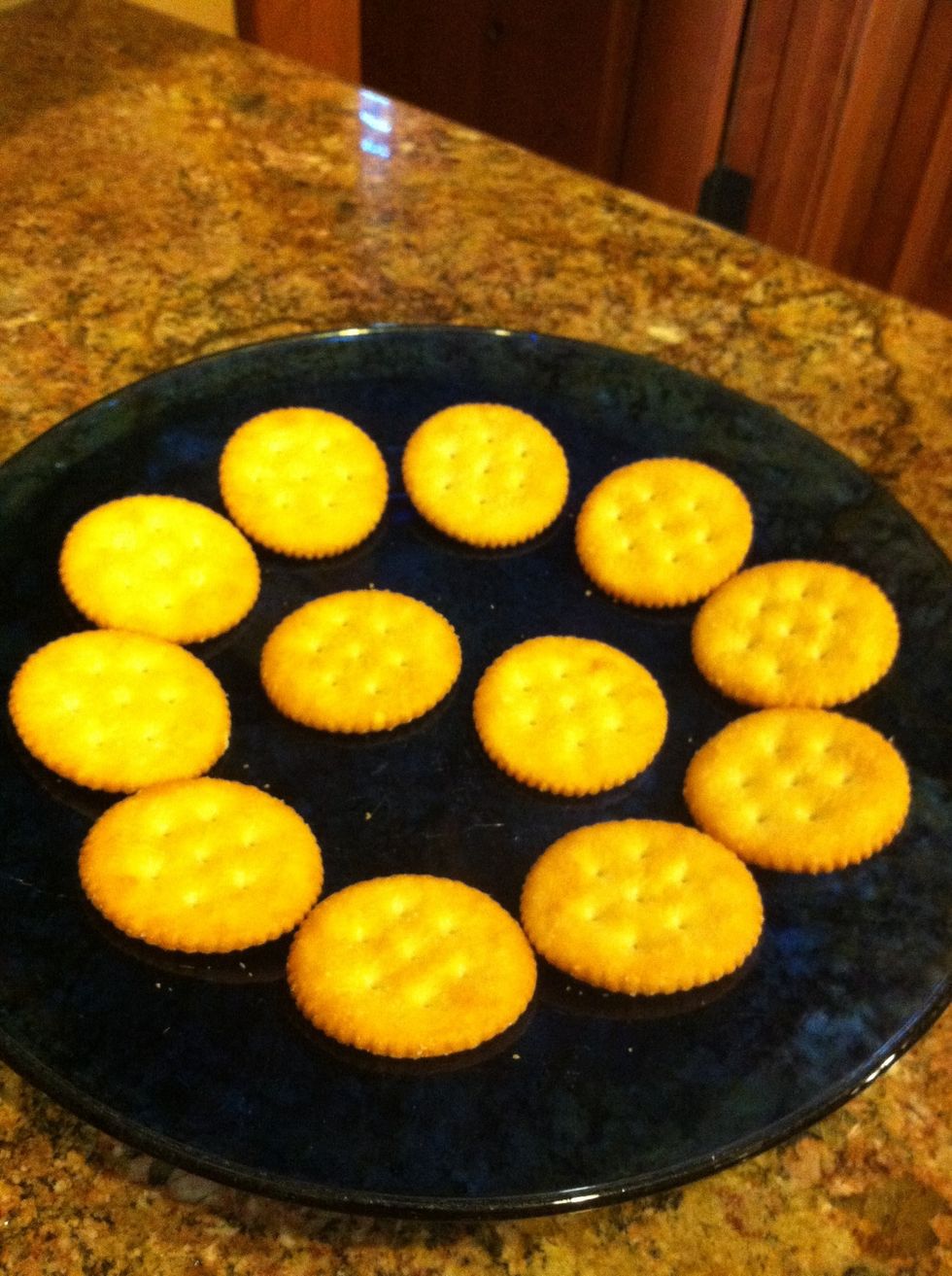 Place the crackers on a plate.