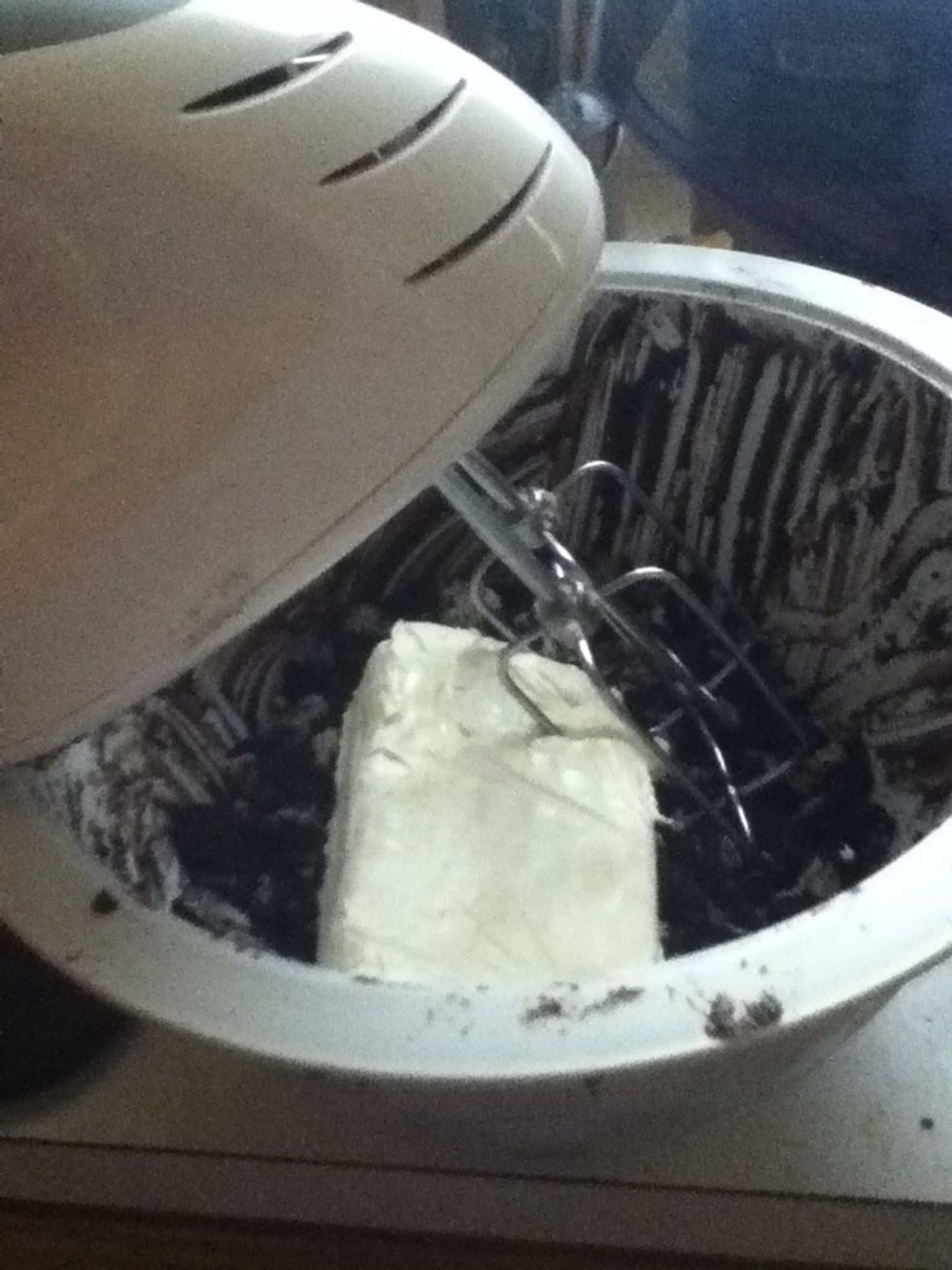 Place the crushed up Oreos in a bowl with the block of cream cheese.