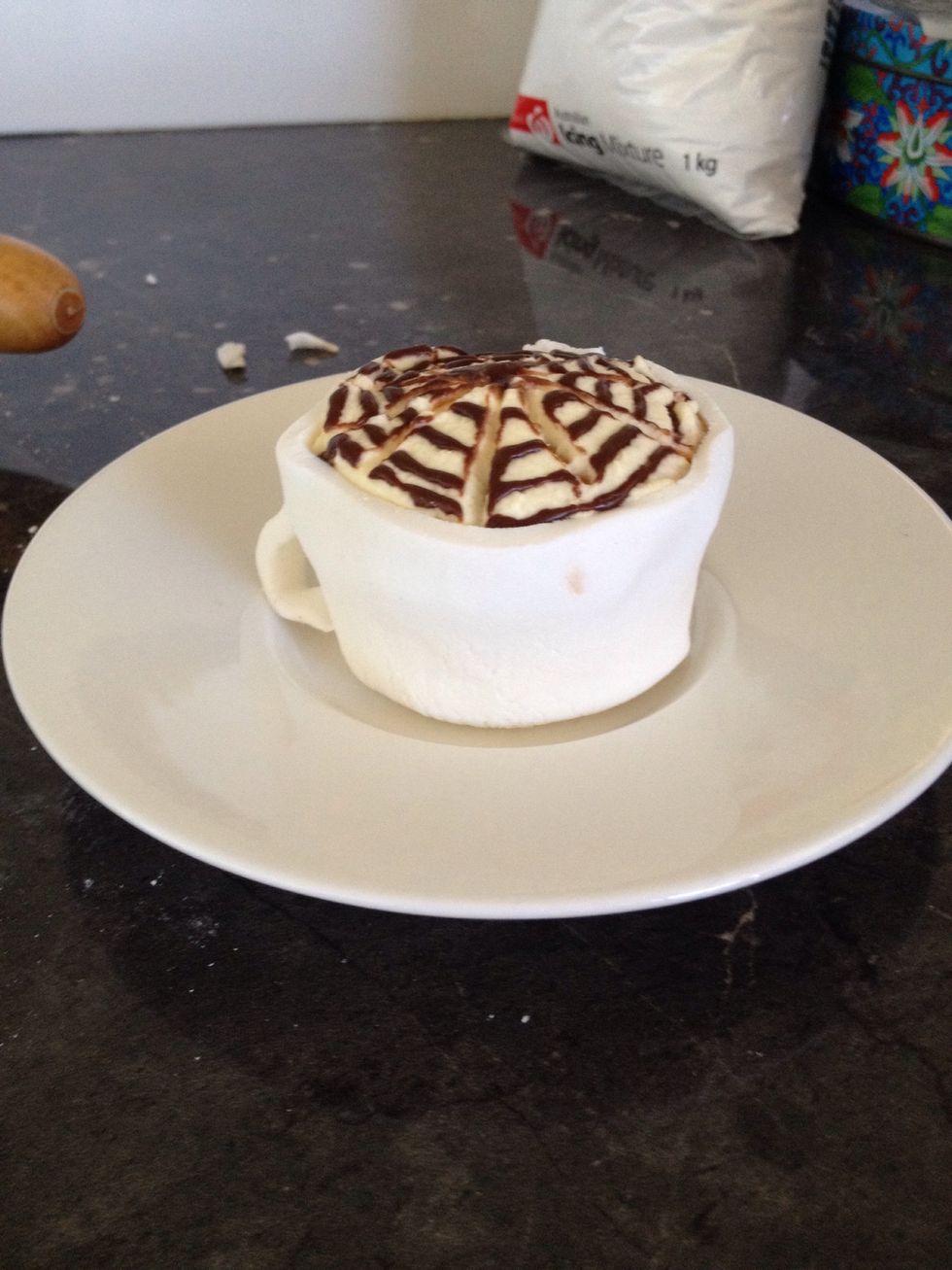 Place the cupcake on a saucer.